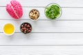 Brain food concept with peanut, hazelnut, seed-oil, spinage on white wooden background top view copyspace Royalty Free Stock Photo