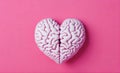 Brain and heart shape mind and emotions in balance for mental health on light pink background Royalty Free Stock Photo