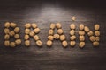 Brain letters sign made with walnuts against wood background. Storm lights. Brainstorming concept. Brain health concept nutrition