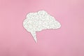 Brain shaped white jigsaw puzzle on pink background,  mental health and problems with memory concept Royalty Free Stock Photo