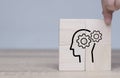 Brain thinking, business brainstorm. Knowledge and ideas head icon on wooden cube. Transferring knowledge, innovation,