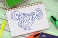 Brain training rock the muscles with a barbell. Creative idea concept
