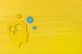 Brain works concept. Thinking, creativity concept of the human head with gears on yellow background Royalty Free Stock Photo