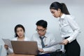 Brainstorm business concept. Confident young Asian employee working together on workplace in office Royalty Free Stock Photo