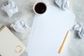 Brainstorm concept with crumpled paper, notebook and cup of coffee Royalty Free Stock Photo