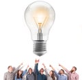 Brainstorming concept with businessmen that indicate an a lamp. Concept of idea and company startup Royalty Free Stock Photo