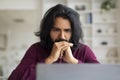 Brainstorming Concept. Thoughtful Indian Man At Workplace Looking At Laptop Screen Royalty Free Stock Photo