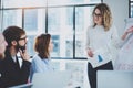 Brainstorming process at office.Young coworkers working together modern meeting room.Horizontal.Blurred background. Royalty Free Stock Photo