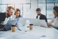 Brainstorming process at office.Young coworkers working together modern meeting room.Horizontal.Blurred background. Royalty Free Stock Photo