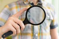 Brainy lad with magnifying glass