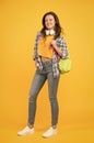 Brainy is new sexy. Happy student yellow background. University student carry backpack. Pretty student smile in casual