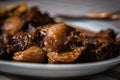 Braised beef with onion and corn polenta Royalty Free Stock Photo