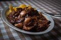 Braised beef with onion and corn polenta Royalty Free Stock Photo