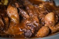 Braised beef with onion and corn polenta Royalty Free Stock Photo