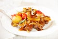 Braised beef with onion sauce and oven baked vegetables Royalty Free Stock Photo
