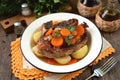 Braised beef with onions and carrots with boiled potatoes. Royalty Free Stock Photo