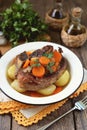 Braised beef with onions and carrots with boiled potatoes. Royalty Free Stock Photo