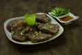 Braised Beef Shanks slice served sesame oil sauce decorate carved cucumber and vegetable Royalty Free Stock Photo