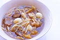 Braised fish maw in red gravy in bowl on white