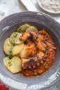 Braised Octopus with Tomato Sauce, Sliced Potato as Side Dish Royalty Free Stock Photo