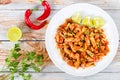 Braised Pig Ears with spices, chili pepper, pieces of lime Royalty Free Stock Photo