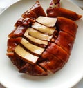 Braised pig feet with dried bean curd on the white plate Royalty Free Stock Photo