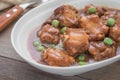 Braised pork ribs with green peas in bowl Royalty Free Stock Photo