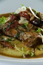 Braised rabbit over polenta Royalty Free Stock Photo