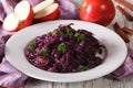 Braised red cabbage with apples close up on a plate. horizontal Royalty Free Stock Photo