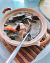 Braised Sea Cucumber in brown soup. Royalty Free Stock Photo