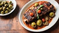 braised smoked grilled ribs with tomatoes, green olives, sauce,onion, for a Mediterranean inspired meal