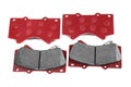 Brake pads. Car brake pads on a white background. Top view of a set of red brake pads. Group of spare parts for the car