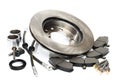 Brake parts on white: brake pads, disc, brake hose, guides, cylinders