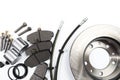 Brake parts on white: brake pads, disc, brake hose, guides, cylinders