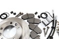 Brake parts on white: brake pads, disc, brake hose, guides, cylinders