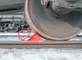 Brake shoe of rail wheel of train on the rail. Winter shoot. Royalty Free Stock Photo