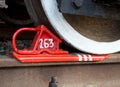 Brake shoe under a railway wagon wheel