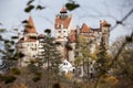 Bran castle among leaves Royalty Free Stock Photo