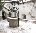 The Bran Castle - snowy fountain in the courtyard Royalty Free Stock Photo