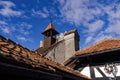 Bran Dracula Castle red tiled rooftop against blue sky in Romania Transylvania