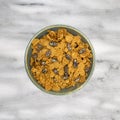 Bran flake cereal with raisins in a stoneware bowl Royalty Free Stock Photo