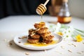 bran muffins with honey drizzle and almond slivers