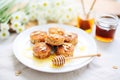 bran muffins with honey drizzle and almond slivers