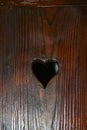 Bran, Romania: A door with a hole in the shape of a heart. The Interior of the medieval Bran Castle, home of Vlad Tepes Dracula, Royalty Free Stock Photo