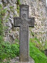 Medieval stone cross at the Bran Castle, known also as DraculaÃ¢â¬â¢s Castle in Transylvania, Romania Royalty Free Stock Photo