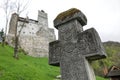 Medieval stone cross at the Bran Castle, known also as DraculaÃ¢â¬â¢s Castle in Transylvania, Romania Royalty Free Stock Photo