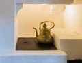 A copper kettle is standing in the oven in the kitchen of the Bran Castle in Bran city in Romania Royalty Free Stock Photo
