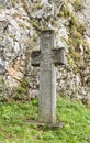 Cross with an inscription on an old Romanian standing in the inner courtyard of the Bran Castle in Bran city in Romania Royalty Free Stock Photo