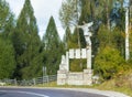 Sculptural group with a metal eagle standing near the road passing at the foot of the Carpathian Mountains near the city of Bran i