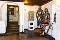 Interior rooms of the medieval Bran Castle in Romania. Antique Knight Armor at Dracula`s Castle Royalty Free Stock Photo